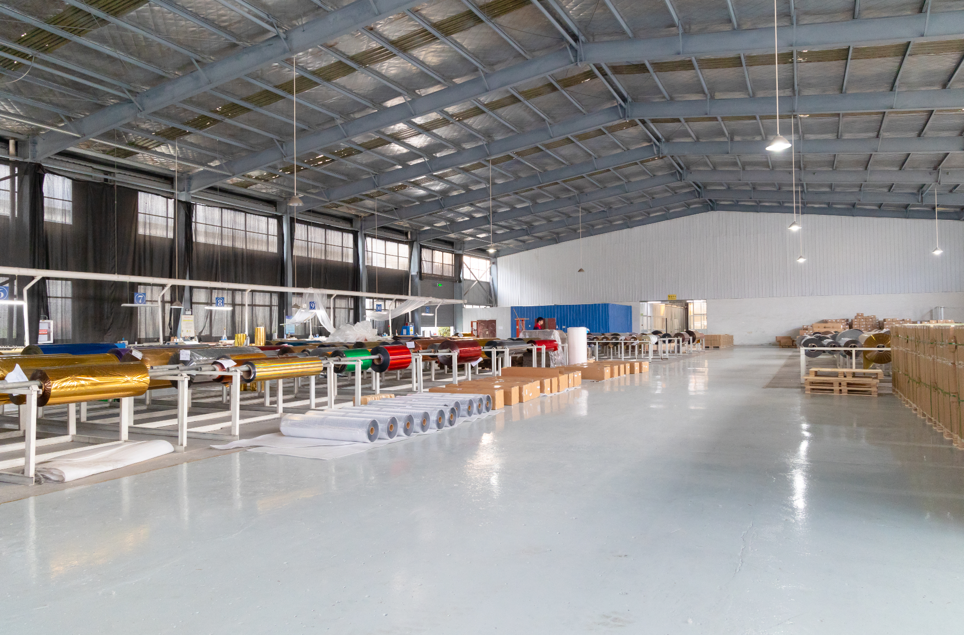 Cold foil stamping foil warehouse — jumbo master rolls of gold, red, blue and green metallised PET foil ready for slitting into sample and production rolls