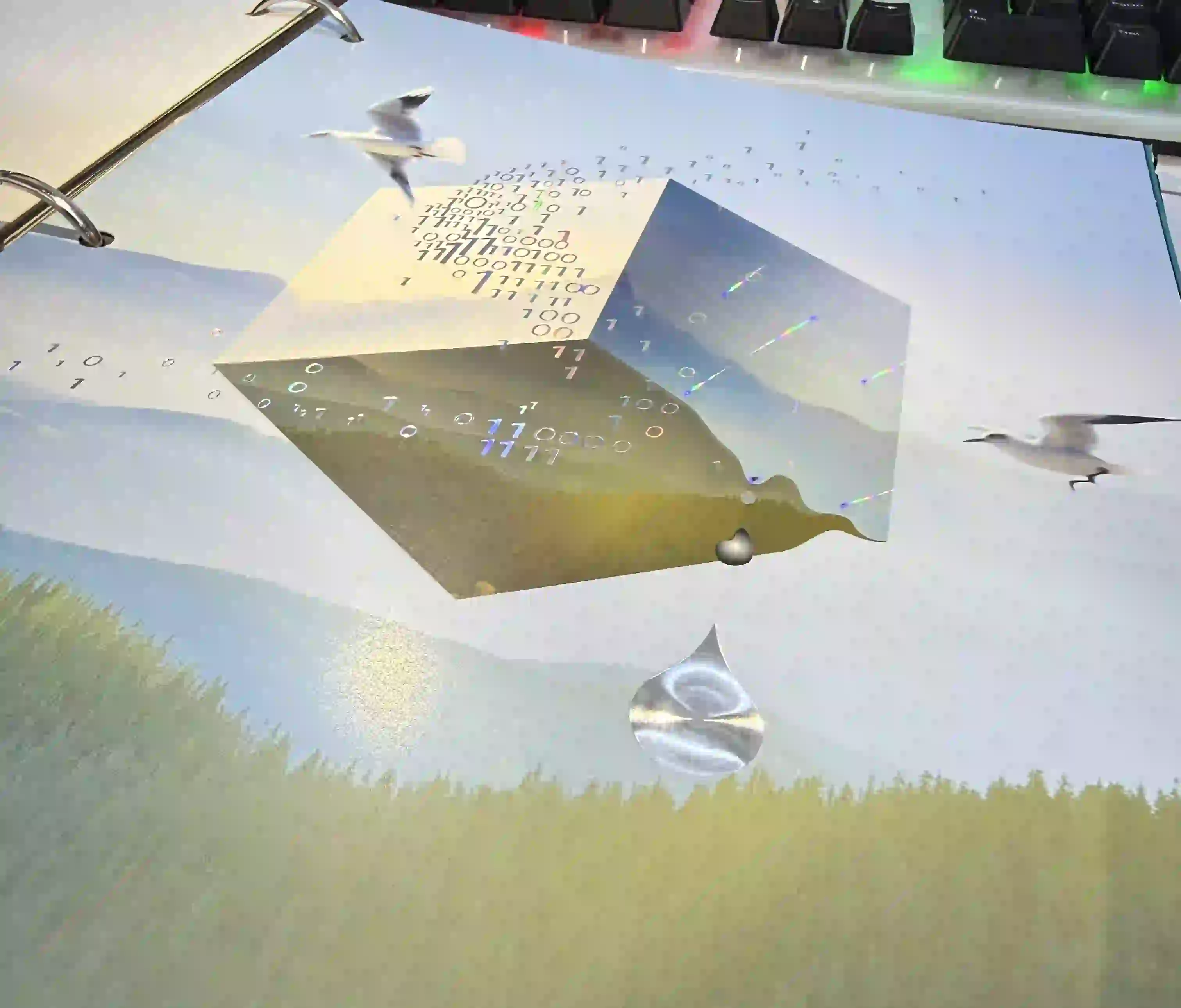 Decorative calendar page with holographic cold foil geometric shapes, metallic droplets and rainbow light refractions on a printed sheet