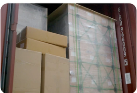 Palletised cold foil cartons loaded into a shipping container for export