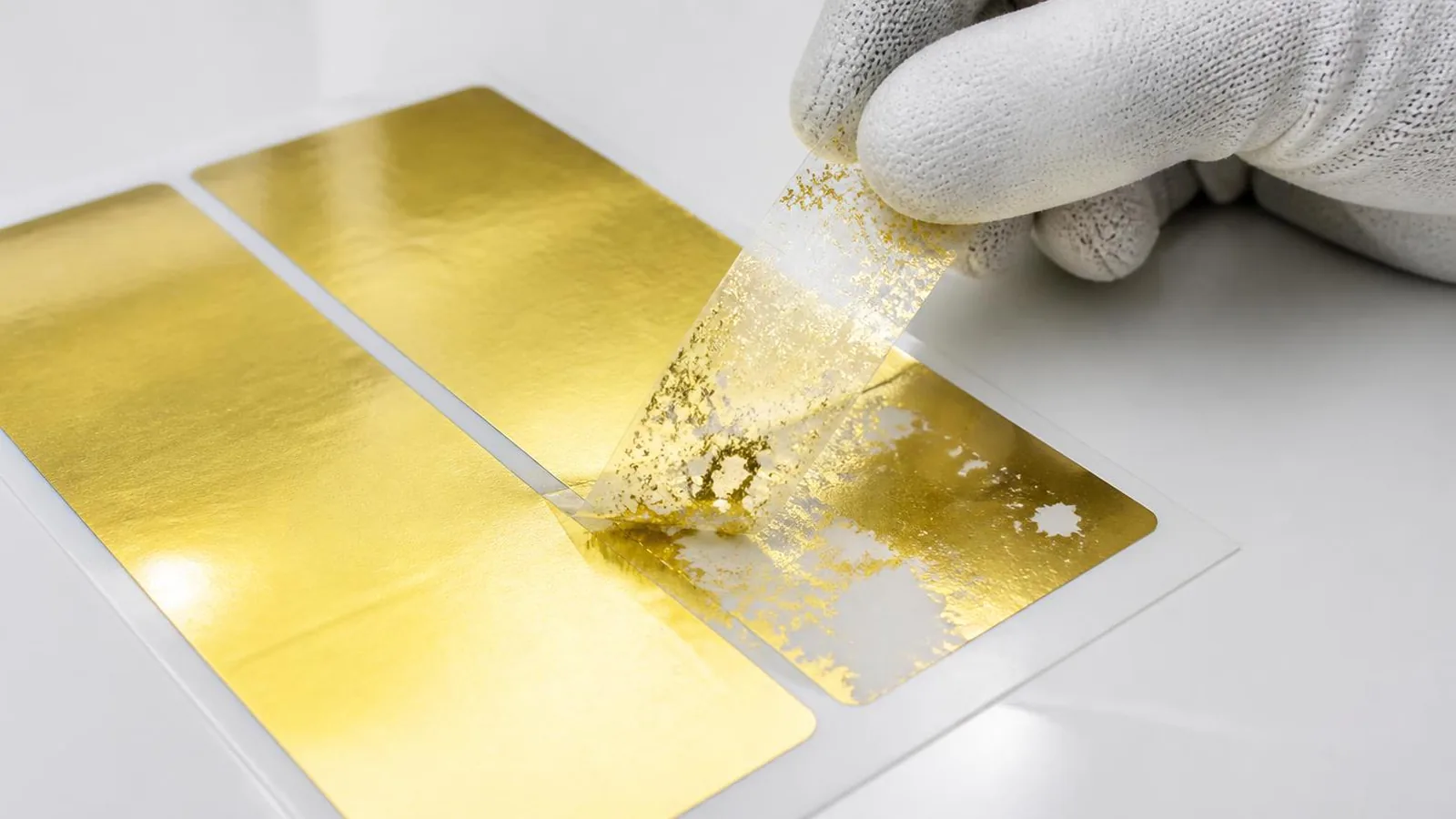Cold foil adhesion failure shown during tape pull test