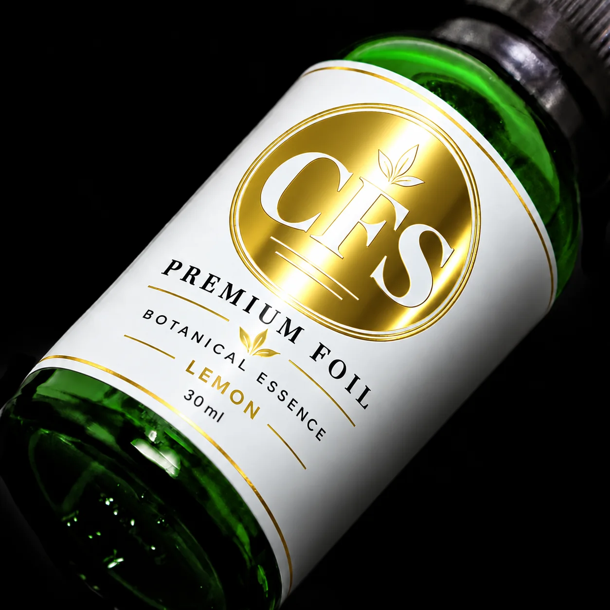 Green glass bottle with a white label featuring a circular gold cold foil emblem on a dark background