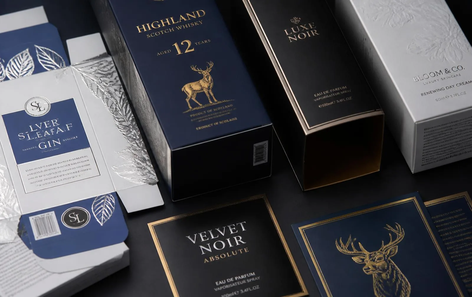 Folding cartons and printed sheets finished with silver and gold cold foil under CMYK overprint