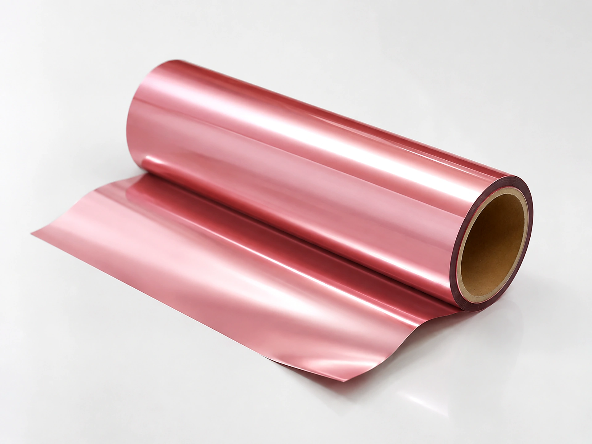 Rose Gold cold foil web unwinding from master roll showing consistent blush metallic coverage edge to edge