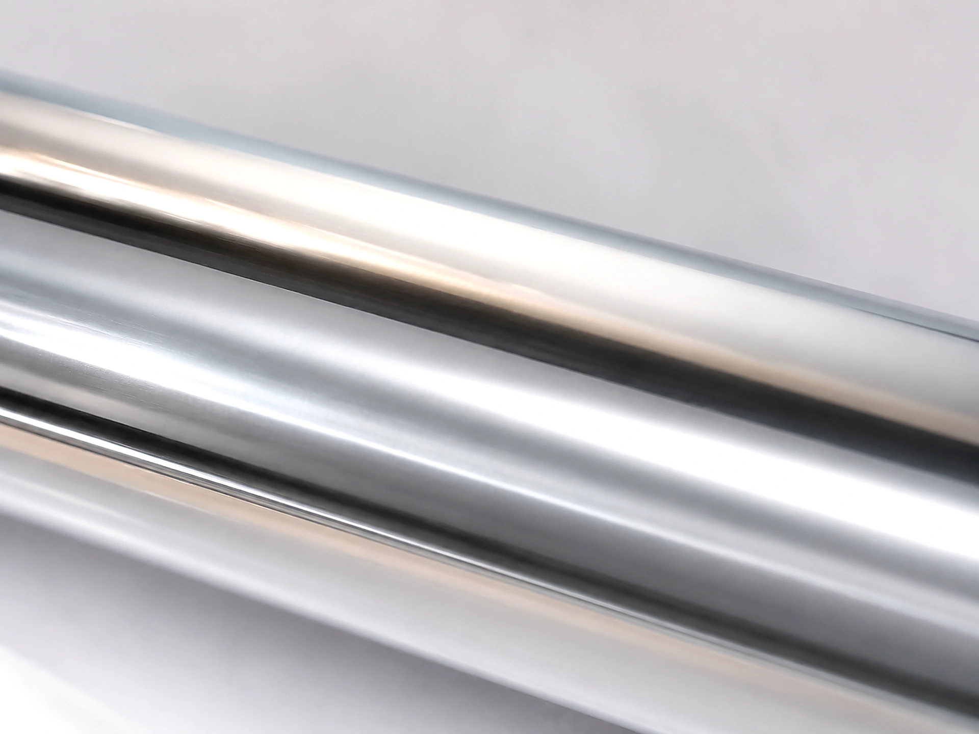 Macro detail of Silver cold foil surface showing 94 GU mirror gloss and true neutral chrome reflectivity